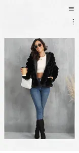 Close-up of black faux fur jacket with 3D bubble texture and hood for winter fashion