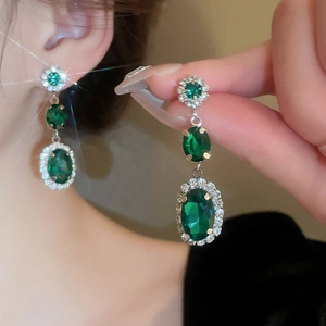 Vintage emerald and diamond drop earrings featuring multi-layered silver finish plating
