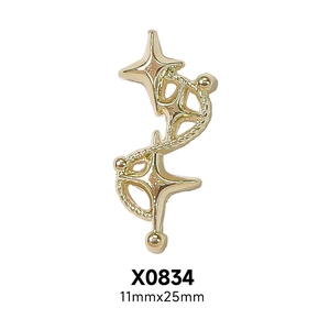 Detail of gold-tone star nail art charm with S-shaped curve design, size 11mm x 25mm