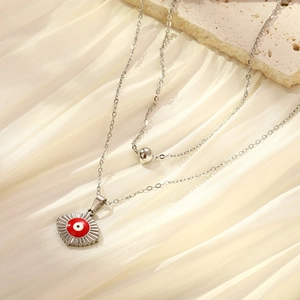 Double-layer silver stainless steel necklace with bead and red evil eye pendant