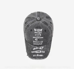 Top view of vintage grey washed denim baseball cap with detailed white embroidery