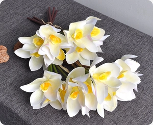 Detailed macro view of 3D printed white and yellow artificial cymbidium orchid petals
