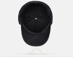 Detail view of winter baseball cap showing warm fleece lining and premium leather brim