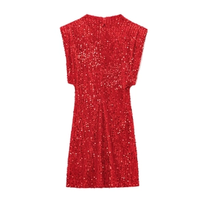 Close-up of shimmering red sequins on a sleeveless mini dress with a round neckline