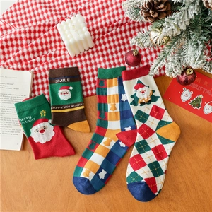 Detailed view of colorful Christmas socks with festive patterns on a holiday tabletop