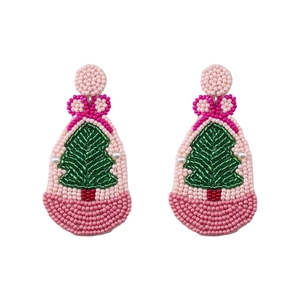 Close-up of handmade beaded Christmas tree earrings with pink base and red bow detail
