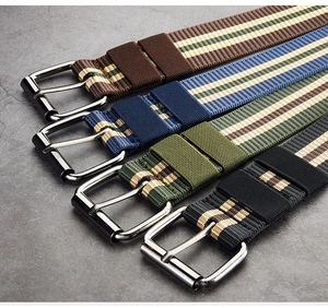Close-up of multicolored canvas striped belts with high-quality metal buckles in diagonal view