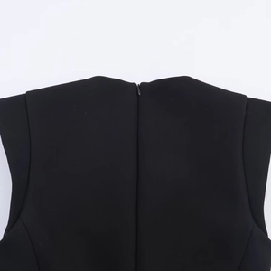 Detail shot of the back invisible zipper closure on this black women's short jumpsuit