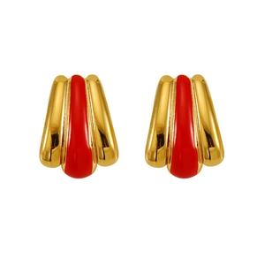 Detailed view of vintage gold-plated stud earrings with red enamel streamlined texture