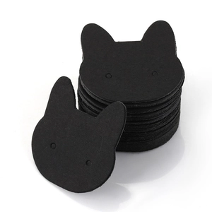 Black cat-shaped earring display cards in a stack for jewelry packaging and display
