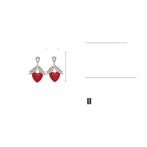 Detail showing dimensions of red resin heart earrings with crystal wings 4.1x6.2cm