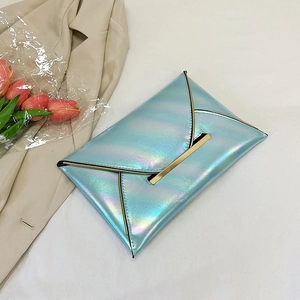 Close-up of iridescent light blue PU envelope clutch with elegant gold metal trim