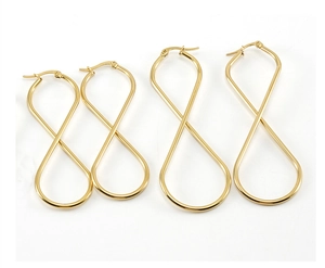 Detailed view of infinity figure-eight gold steel earrings in two different sizes