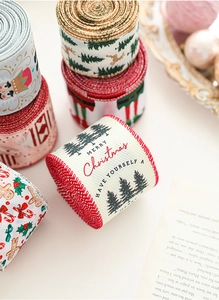 Close-up of Christmas ribbed ribbons with cedar tree and nutcracker holiday patterns