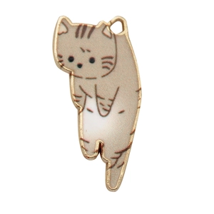 Detailed close-up of a cartoon cat pendant with gold-plated edges and brown enamel finish