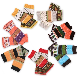 Colorful knitted fingerless Christmas tree gloves with festive winter snowflake patterns