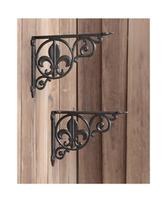 Macro detail of industrial cast iron brackets with vintage fleur-de-lis floral patterns