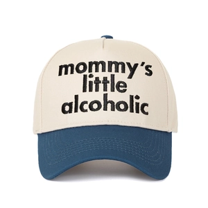 Close-up of Mommy's Little Alcoholic embroidery on two-tone cotton baseball cap