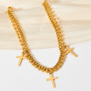 Gold double-layered cross pendant anklet with bead chain on elegant silk fabric
