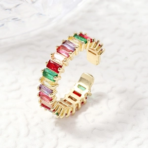 Adjustable gold ring with colorful baguette-cut stones in a rainbow pave setting