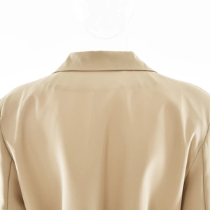 Detail view of khaki cardigan back collar showing clean tailoring and matte fabric texture