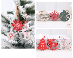 Detailed view of colorful wooden Christmas tree ornaments with snow and deer patterns