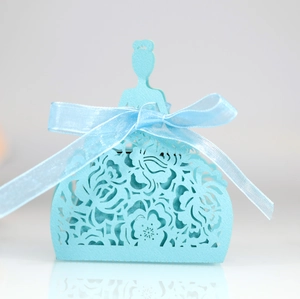 Detail of laser-cut light blue princess dress candy box with elegant ribbon bow