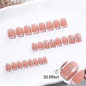 French gradient press-on nails in light yellow with silver 3D bow accents and glossy finish