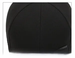 Detail of black cotton baseball cap showing reinforced six-panel stitching and sport logo