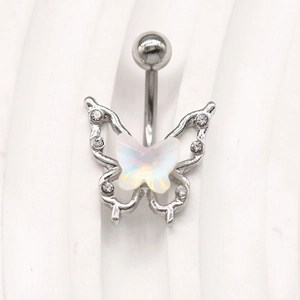 Detail of silver butterfly belly ring featuring white opal center and sparkling rhinestones