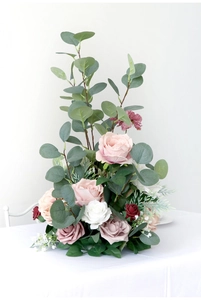 Close-up of elegant silk roses and eucalyptus leaves for wedding flower arrangement