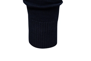 Macro shot of navy blue ribbed cuffs on a men's V-neck knit sweater in close-up