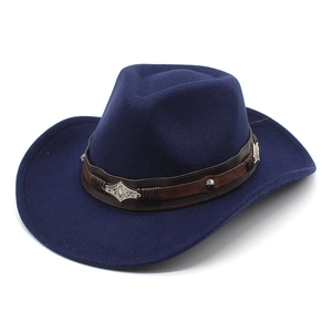 Detail of navy blue felt cowboy hat featuring brown leather band with silver metal conchos