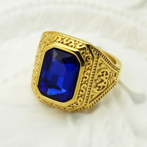 Macro shot of gold vintage Viking ring featuring a large square blue gemstone inlay