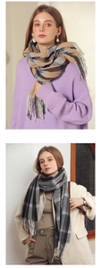 Detail of plaid scarves with fringe in classic color patterns for winter fashion