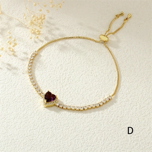 Detail of adjustable gold-plated bracelet with purple heart stone and zircon accents