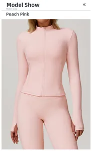 Detail of peach pink yoga set showing stand collar zipper and thumb hole sleeves