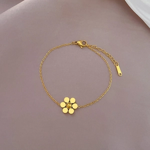 Detail of gold floral beaded chain bracelet made of durable stainless steel finish