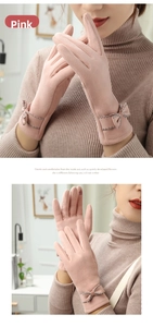 Detail of pink thermal touchscreen gloves featuring a delicate bow and scalloped wrist edge