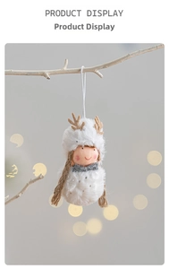 Detail showing a white plush Christmas deer doll with silver bow hanging on branch