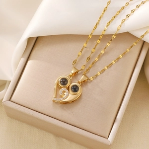 Luminous heart matching couple necklaces set with crystal inlay in gold finish