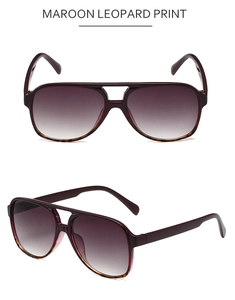 Detail of maroon leopard print aviator sunglasses with purple gradient lenses on white