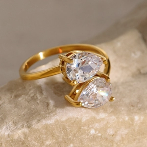 Macro shot of gold stainless steel Toi et Moi ring with double pear-cut zircon stones