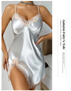 Detail of light blue satin nightgown featuring delicate lace trim and elegant high slit