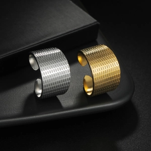 Exaggerated wide stainless steel rings in gold and silver with vertical texture
