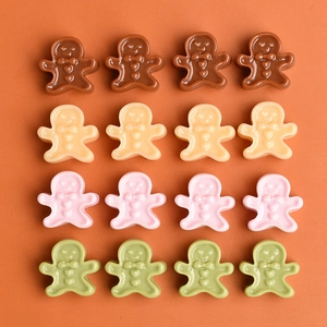 Miniature resin gingerbread men in brown, orange, pink and green for DIY crafts