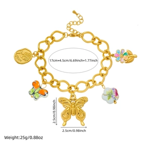 Gold chain bracelet with colorful ceramic painted butterfly and floral enamel charms