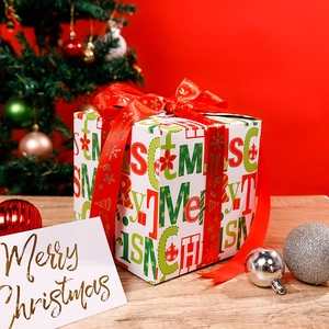 Christmas gift wrap paper rolls with festive prints, red ribbons, and holiday gift box decor
