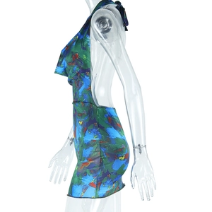 Detail of teal abstract oil painting print on backless halter neck mini silk dress
