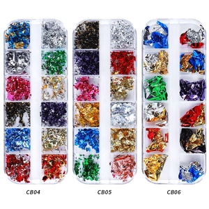 Three 12-grid boxes containing assorted colorful nail art gold and silver foil flakes